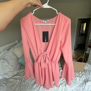 Pink Romper with front Bow in size S